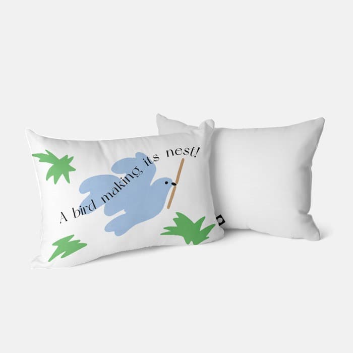 a bird making its nest 베개 커버 이미지